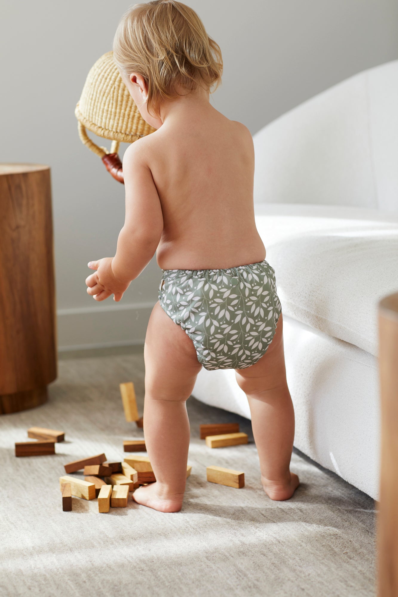 baby playing in cloth nappies 